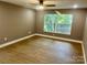 Spacious bedroom featuring hardwood floors and large windows at 1243 10Th Street Nw Pl, Hickory, NC 28601