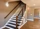 Modern staircase with dark wood and metal railings at 1243 10Th Street Nw Pl, Hickory, NC 28601
