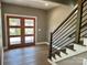 Entryway with modern staircase and double doors at 1243 10Th Street Nw Pl, Hickory, NC 28601