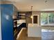 Contemporary kitchen with navy blue cabinets, white quartz countertops, and stainless steel appliances at 1243 10Th Street Nw Pl, Hickory, NC 28601