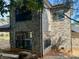 Rear exterior view showcasing brickwork and large windows at 1243 10Th Street Nw Pl, Hickory, NC 28601