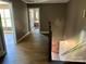 Bright hallway with hardwood floors leading to bedrooms and bathroom at 1243 10Th Street Nw Pl, Hickory, NC 28601
