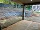 Covered patio with retaining wall and ample space for outdoor furniture at 1243 10Th Street Nw Pl, Hickory, NC 28601