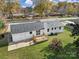 Aerial view showcasing a ranch house with a deck and large backyard at 619 Fieldstone Rd, Mooresville, NC 28115