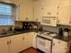 Bright kitchen, white cabinets, and a gas range at 2808 Findley Rd, Statesville, NC 28625