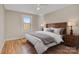 Main bedroom with wood floors and a brown wooden bed frame at 2908 13Th Sw Ave, Hickory, NC 28602