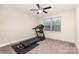 Bedroom with treadmill and large window at 8127 Caliterra Dr, Charlotte, NC 28227