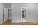 Bedroom with hardwood floors and en-suite bathroom access at 1010 W Catawba Ave, Mount Holly, NC 28120