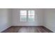 Spacious bedroom featuring wood-look floors and ample natural light at 558 Geneva Cir, Gastonia, NC 28056