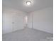 Bright bedroom with double doors and grey carpet at 558 Geneva Cir, Gastonia, NC 28056