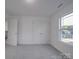 Bright bedroom with double doors and grey carpet at 558 Geneva Cir, Gastonia, NC 28056