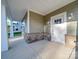 Covered front porch with stone base and white door at 558 Geneva Cir, Gastonia, NC 28056