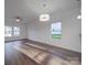 Bright dining room with hardwood floors and chandelier at 558 Geneva Cir, Gastonia, NC 28056