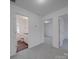 Bright hallway with carpet, leading to bedrooms and bathroom at 558 Geneva Cir, Gastonia, NC 28056