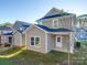 Rear view of two story house with attached shed and patio at 558 Geneva Cir, Gastonia, NC 28056