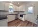Modern kitchen with white cabinets, stainless steel appliances, and granite countertops at 558 Geneva Cir, Gastonia, NC 28056