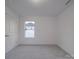 Spacious bedroom with window and grey carpet at 558 Geneva Cir, Gastonia, NC 28056