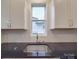 Modern kitchen with sink, white cabinets, and granite countertops at 558 Geneva Cir, Gastonia, NC 28056