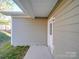 Rear exterior showing additional access door and patio at 558 Geneva Cir, Gastonia, NC 28056