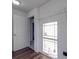 Laundry room with window, shelving and door to bathroom at 558 Geneva Cir, Gastonia, NC 28056