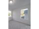 Spacious bedroom with carpet, large window, and great natural light at 558 Geneva Cir, Gastonia, NC 28056