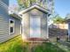 Detached storage shed with white door, providing extra storage space at 558 Geneva Cir, Gastonia, NC 28056