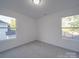 Bedroom with two windows and grey carpet at 558 Geneva Cir, Gastonia, NC 28056