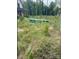 Overgrown lot with weeds and some construction debris at 4293 Brandy Creek Ct # 91, Clover, SC 29710