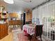 Charming dining area with a round table and access to the back patio at 7676 Shoupes Grove Church Rd, Hickory, NC 28612