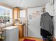 Small pantry with wooden cabinets and additional storage at 7676 Shoupes Grove Church Rd, Hickory, NC 28612