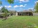 Detached workshop with covered storage area and large grassy yard at 7676 Shoupes Grove Church Rd, Hickory, NC 28612