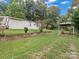 Landscaped yard with storage building and carport at 7676 Shoupes Grove Church Rd, Hickory, NC 28612