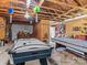 Game room with pool table, air hockey, and sitting area at 7676 Shoupes Grove Church Rd, Hickory, NC 28612