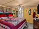 Spacious main bedroom with a king-size bed and ceiling fan at 7676 Shoupes Grove Church Rd, Hickory, NC 28612