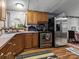 Kitchen with wood cabinets, stainless steel appliances, and a tile backsplash at 7676 Shoupes Grove Church Rd, Hickory, NC 28612