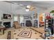 Cozy living room featuring a fireplace, ceiling fan, and comfortable seating at 7676 Shoupes Grove Church Rd, Hickory, NC 28612