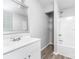 Clean bathroom with white vanity, shower, and vinyl flooring at 185 17Th Se St, Hickory, NC 28602