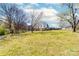 Large backyard with trees and a partly visible house at 185 17Th Se St, Hickory, NC 28602