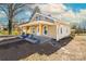 Beige house with a front porch and landscaping at 185 17Th Se St, Hickory, NC 28602