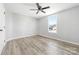 Well-lit bedroom with ceiling fan and vinyl plank floors at 185 17Th Se St, Hickory, NC 28602