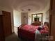 Cozy bedroom with a window and dresser at 1982 Hopewell Church Rd, Hiddenite, NC 28636