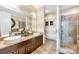 Elegant bathroom with double sinks and a glass shower at 215 N Pine St # 3705, Charlotte, NC 28202