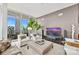 Bright living room with floor-to-ceiling windows and city views at 215 N Pine St # 3705, Charlotte, NC 28202
