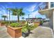 Rooftop patio with pergola, seating, and lush landscaping at 215 N Pine St # 3705, Charlotte, NC 28202