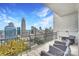 Relaxing balcony with city views and comfortable seating at 215 N Pine St # 3705, Charlotte, NC 28202