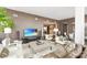 Spacious living room featuring comfortable seating and large TV at 215 N Pine St # 3705, Charlotte, NC 28202