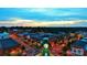 Aerial view of a town at sunset, featuring a clock tower at 120 Bost St, Statesville, NC 28677