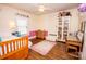 Cheerful bedroom with hardwood floors and a custom window treatment at 120 Bost St, Statesville, NC 28677