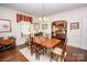 Formal dining room with hardwood floors and view into living area at 120 Bost St, Statesville, NC 28677