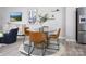 Dining area with a round glass table and four leather chairs at 3016 Pirates Pl, Charlotte, NC 28216